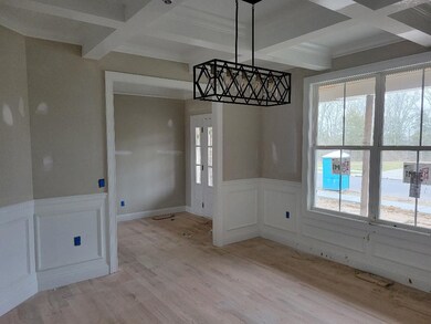 Separate dining room with coffered ceiling.  Home office???