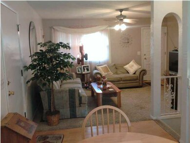 LIVING ROOM WITH NEW CARPET