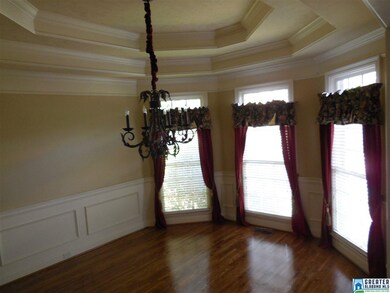 Take note of the beautiful triple trey ceilings wi