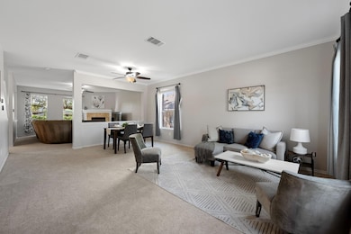 Living room featuring a tile fireplace, light col