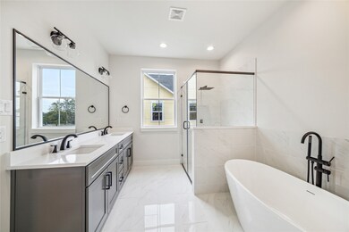 This modern bathroom features a spacious layout wi