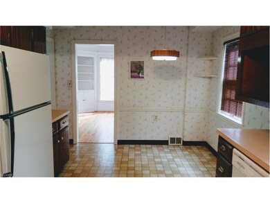 Eat-in area of kitchen view to dining room in home