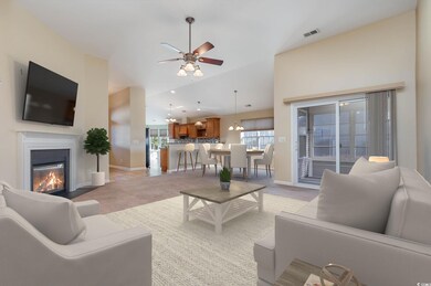 Carpeted living room featuring ceiling fan with no