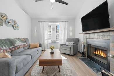 Living area with wood finished floors, a tile fir