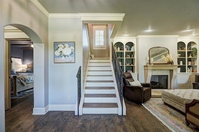 Stairs with wood finished floors, built in feature