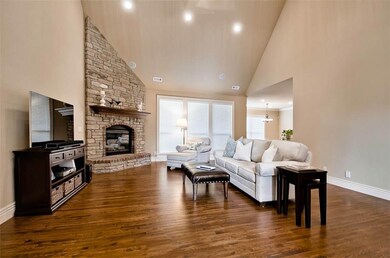Beautifully mixed stone & brick fireplace, soaring