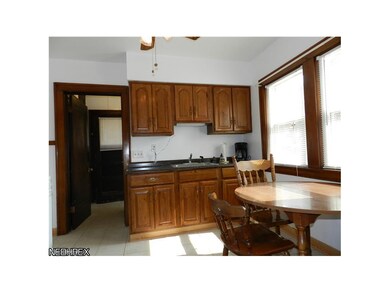 Eat-in-kitchen with newer cabinets, sink and fixtu