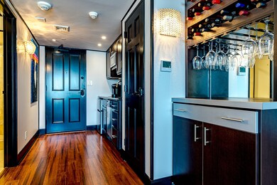 Custom built cabinetry and bar with wine rack