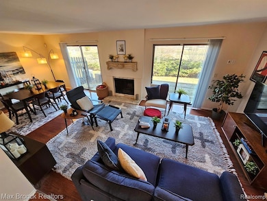 Living room featuring wood finished floors and a fireplace