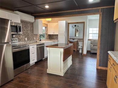 Kitchen featuring stainless steel appliances, a w