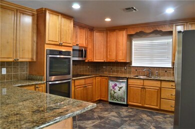 granite counters, double oven, all appliances rema