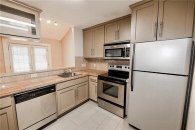 Kitchen featuring appliances with stainless steel