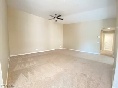 Unfurnished room with light carpet and ceiling fan