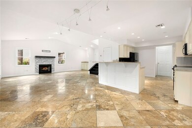 Open floor plan Travertine stone floor throughout