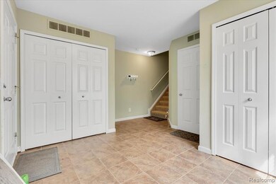 Foyer with stairway and baseboards
