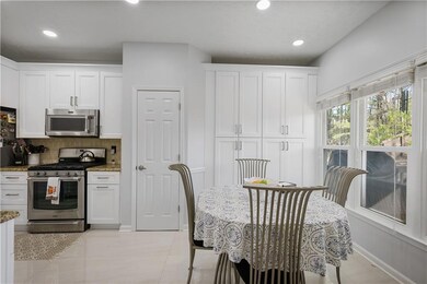 Kitchen with recessed lighting, appliances with st