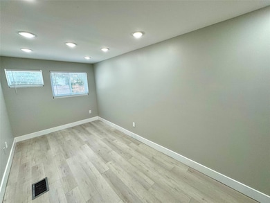 Unfurnished room with light hardwood / wood-style 