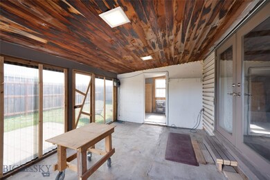 Enclosed Carport/Workshop Area with Storage Room