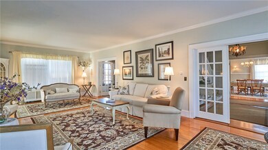 Front-to-back living room to left of foyer.