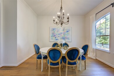 Step into sophistication in the elegantly designed dining room. Large windows and crown molding exude an aura of refined dignity, while all new lighting fixtures offers both functionality and style perfect for inspiring your dinner parties