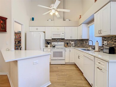 Kitchen has a huge walk in pantry. Countertops are quartz.