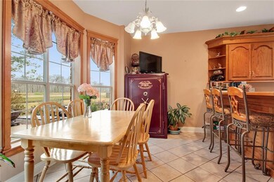 Eat-in breakfast area overlooking the well landsca