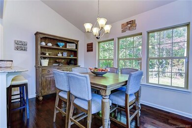 Roomy breakfast nook/sunroom with vaulted ceiling 