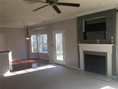 Spacious living room with fireplace, television no
