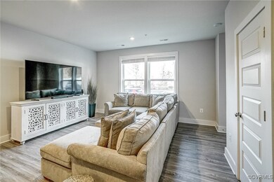 Living room with hardwood / wood-style flooring