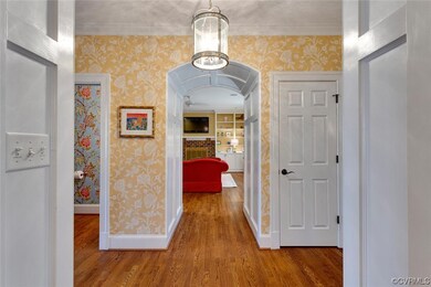 Corridor featuring paneled molding