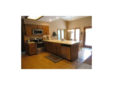 Kitchen and breakfast area with large windows and 