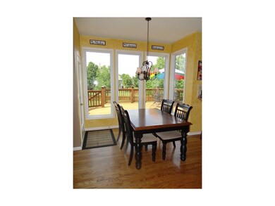 Breakfast Room With Hardwood Flooring, Open To The