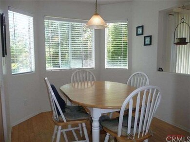 Dining nook in the kitchen with wood floors and a 