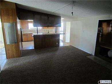 Living room looking into kitchen