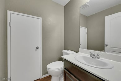 Bathroom with vanity, wood finished floors, and a