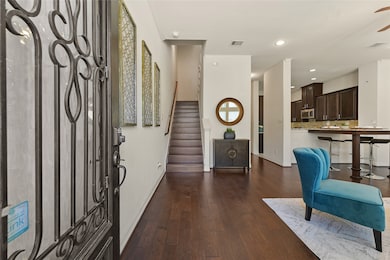 Upon entering you are greeting by the living room, kitchen, and staircase.