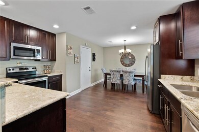 Kitchen with granite counter tops, stainless steel