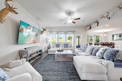 Living room featuring wood finished floors, ceili