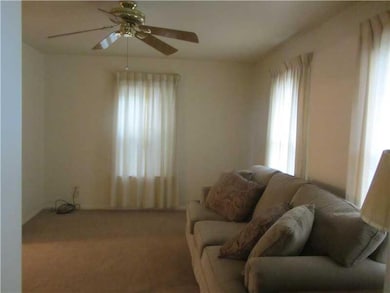Living Room. Living room with ceiling fan-window t