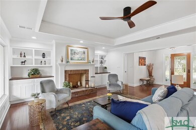 Built in bookcases and woodturning fireplace in th