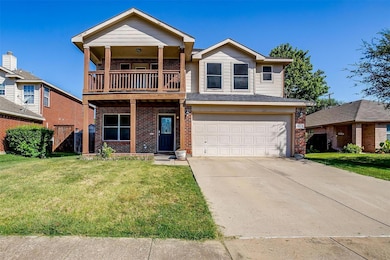 View of front of home with an attached garage, a b