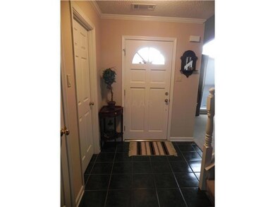 Foyer with tile and coat closet welcomes you!