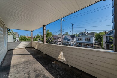 View of patio featuring a balcony