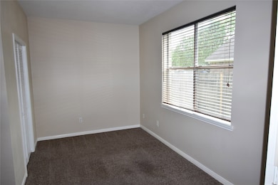 A bedroom on the first floor, not master.  4 bedroom, 2.5 baths, Klein Schools, 21147 Covington Bridge Dr., Spring, Tx 77338