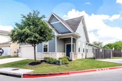 View of front of property with driveway, stone si