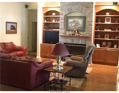 Living Room. living room view showing built ins.  Pull out drawers on bottom right side.