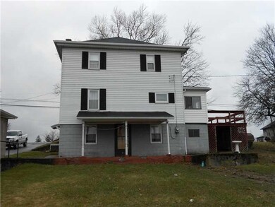 Exterior Back. Back of the home showing deck and c