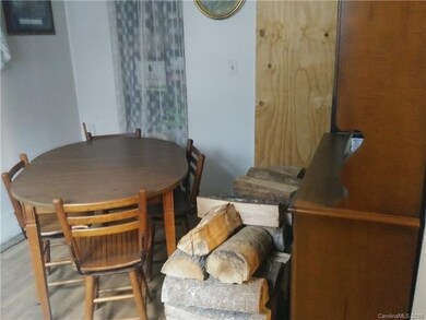 Dining room with entrance  to kitchen and entrance