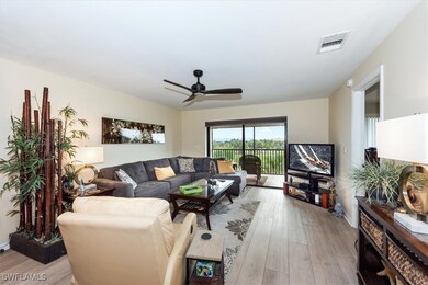 Living room with light wood-type flooring and ceil