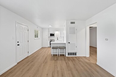 Living area featuring light wood-type flooring an